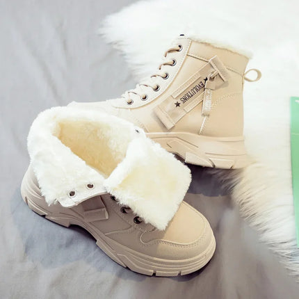 Beige winter boots with white fur lining on a light gray background