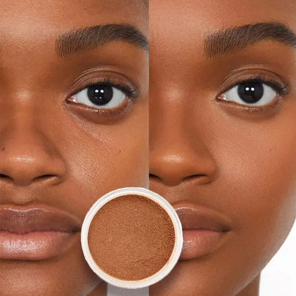 Close-up of a woman's face with a color swatch of brown makeup.